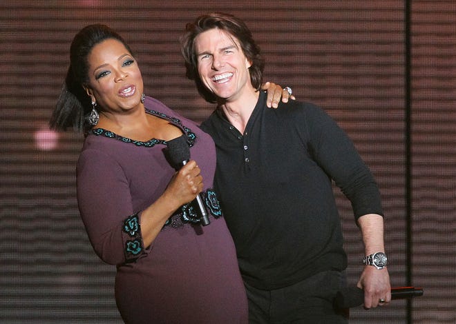Tom Cruise, right, appears with Oprah Winfrey during a star-studded double-taping of "Surprise Oprah! A Farewell Spectacular," Tuesday, May 17, 2011, in Chicago. "The Oprah Winfrey Show" is ending its run May 25, after 25 years, and millions of her fans around the globe are waiting to see how she will close out a show that spawned a media empire. (AP Photo/Charles Rex Arbogast)