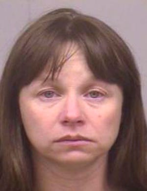 This 2005 file booking photo provided by the Dallas County Jail shows Julianne McCrery of Irving, Texas.  Prosecutors say McCrery has been arrested in Massachusetts following accusations that she killed her young son, whose body was found along a dirt road in Maine.