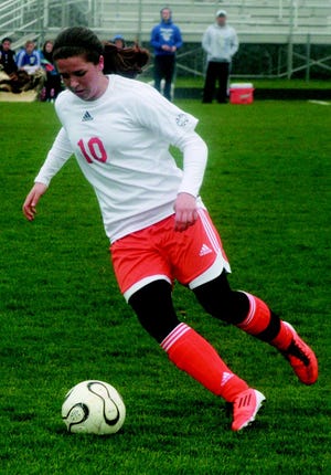 ?Olivia Archambo looks to make a play up the field during the first half.