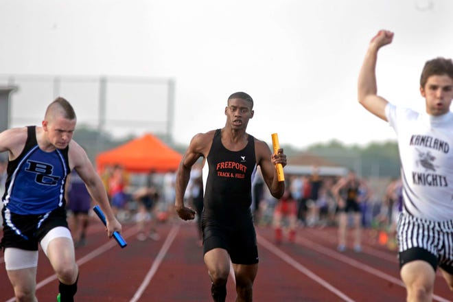 Freeport High School's Brandon McShane crosses the finish line in the 400-meter relay Thursday, May 19, 2011, during the IHSA Class 2A Sectional track meet in Rochelle.