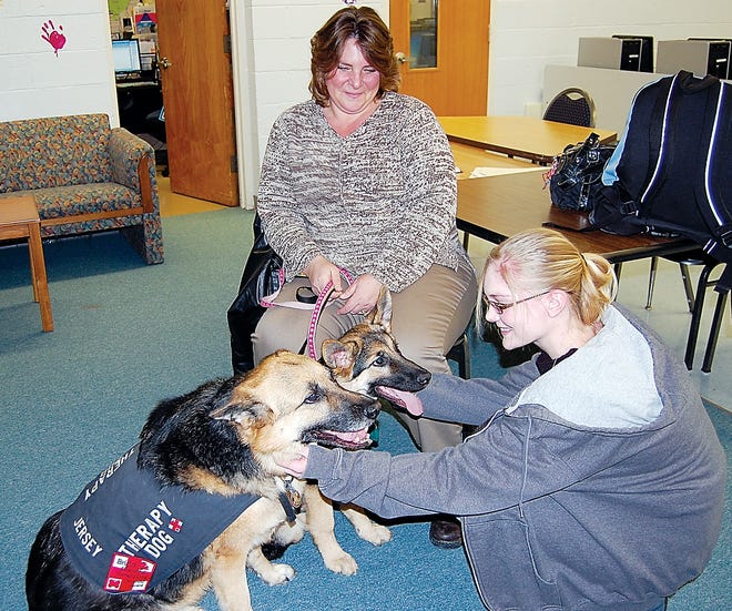 Submitted Photo 
Handler Chris Stefani introduces her therapy dogs to North Warren Regional High School student Christina Nitzche.