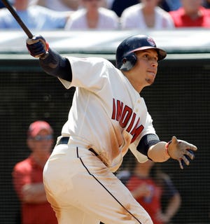 AP Photo/Tony Dejak 
Cleveland Indians’ Asdrubal Cabrera hits an RBI-single off Cincinnati Reds pitcher Jordan Smith in the seventh inning Sunday. Cabrera was 5-for-5 with two homers.