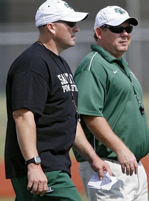 Lance Manning (left) Edmond Santa Fe High School's new Head Football Coach, and Kenny Young, (right) the new Defensive Coordinator, watch the Wolves during football practice at Edmond Santa Fe High School in Edmond, Oklahoma, on Wednesday, May 18, 2011. Photo by John Clanton, The Oklahoman ORG XMIT: KOD JOHN CLANTON - JOHN CLANTON