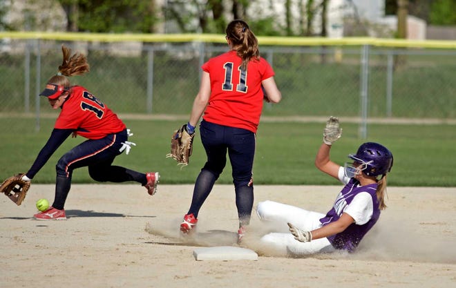 Hononegah's Erica Carrington slides into second as Belvidere North's Emily Hawkins watches as Holly Hilden fields the ball in the first-inning Tuesday, May 17, 2011, at Thunder Park in Roscoe.