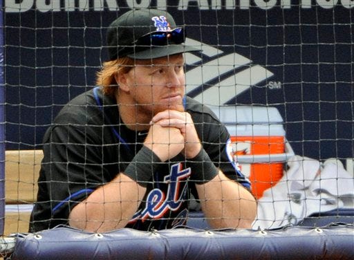 Mets' Justin Turner looks on from the dugout during the ninth inning against the Yankees, Sunday, May 22, 2011, at Yankee Stadium in New York. The Yankees won 9-3.