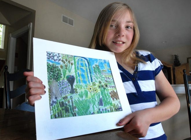 12-year-old Hanna O'Neill (Plumstead) holds the illustration she drew and was featured in Highlights magazine,a national publication.