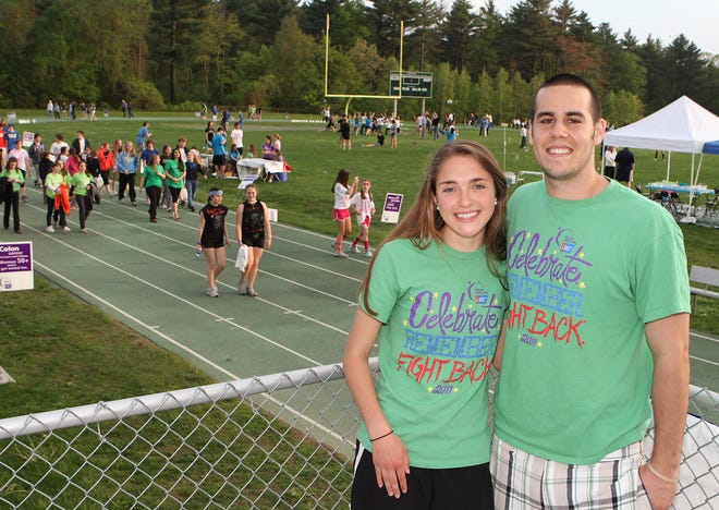 Hopkinton High School students Jennifer Lynds and Will Relle stand together during the Relay for Life at Hopkinton High School on Friday evening. Lynds and Relle worked together to organize the event, with planning that began last September.