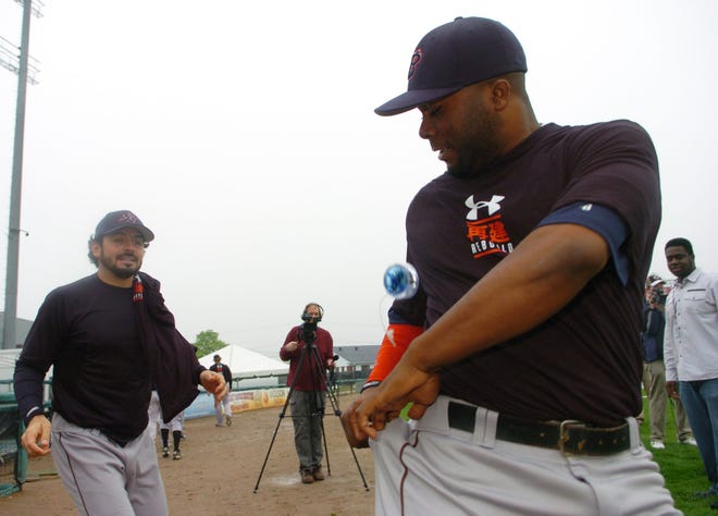 Melvin Falu, right, tries to catch a Yo Yo from his teammate Dominic Ramos, left, during Brockton Rox media day on Wednesday, May, 17, 2011, at Campanelli Stadium in Brockton.