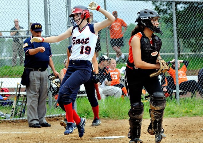 CB East's Allie Chase (19) celebrates after she got a two run home run in the bottom of the sixth inning with Perkiomen Valley catcher Andrea Conte looks towards the infield during a PIAA District One Class AAAA First Round at CB East in Buckingham Monday. CB East went on to win the game 5-1.