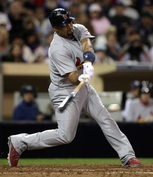 St. Louis Cardinals' Albert Pujols drives his eighth home run of the season, and the first in 105 at bats, into the left field seats against the San Diego Padres in the sixth inning of a baseball game Monday, May 23, 2011 in San Diego. (AP Photo/Lenny Ignelzi)