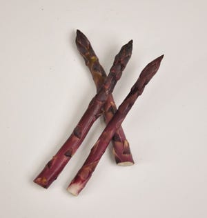 The deep color of purple asparagus is striking -- but it fades when the stalks are cooked.