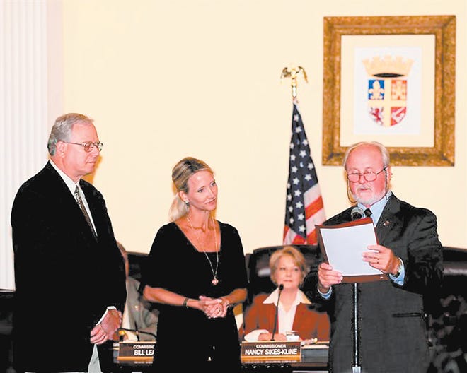 St. Augustine Mayor Joe Boles presents St. Johns Circuit Judges Clyde E. Wolfe and Wendy W. Berger with proclamations from the city that declared May to be National Drug Court Month. Berger has presided over the adult drug court since 2006. Wolfe, who has presided over the juvenile drug court since August, actively participates in steering committee meetings. Contributed photo