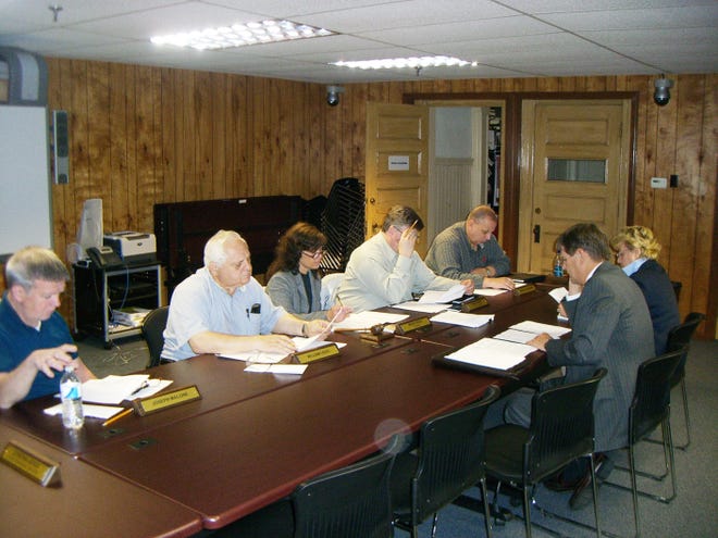 School Committee members Joseph Malone, William Leuci, Chairman Wendy Reed, Thomas Stewart and Arthur Grabowski discuss the fiscal 2012 budget with Superintendent of Schools Richard Langlois and Executive Director of Pupil Personnel Services and Special Education Cynthia Joyce.