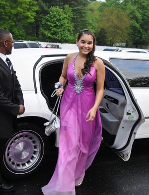Amy Coole arrives at the Bridgewater-Raynham senior prom in style Friday night at Lakeview Pavillion in Foxboro.