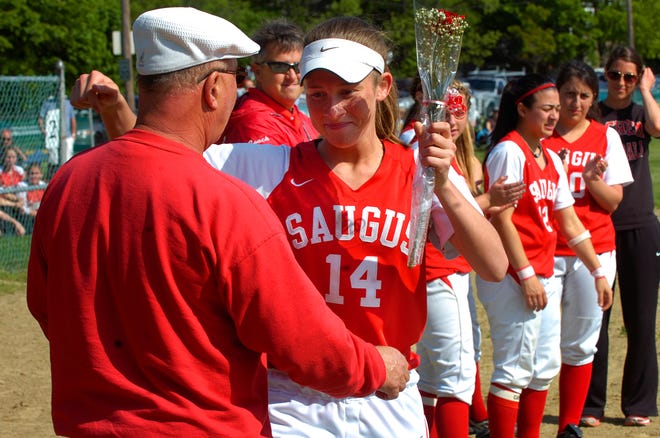 Saugus softball senior centerfielder Jackie Doherty hugs her dad, Daniel, after receiving a rose on Senior Day prior to the start of the team's last regular season home game versus Winthrop May 25.