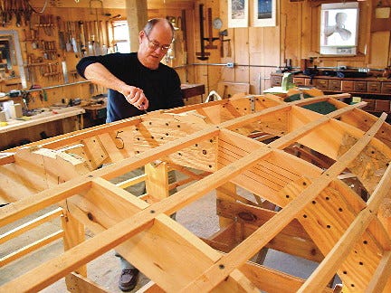 Sterling Klink begins forming ribs for a catspaw dinghy, a small sail and rowing boat at East Hill Boat Shop located at the Folk Art Guild in Middlesex.