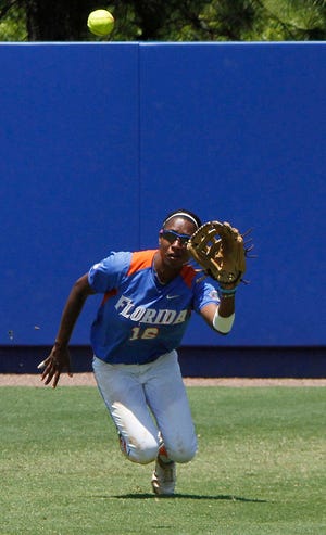Florida's Michelle Moultrie, a former Mandarin High standout, eyes the ball for a catch in center field against Oregon in the NCAA Softball Super Regionals on Saturday in Gainesville.