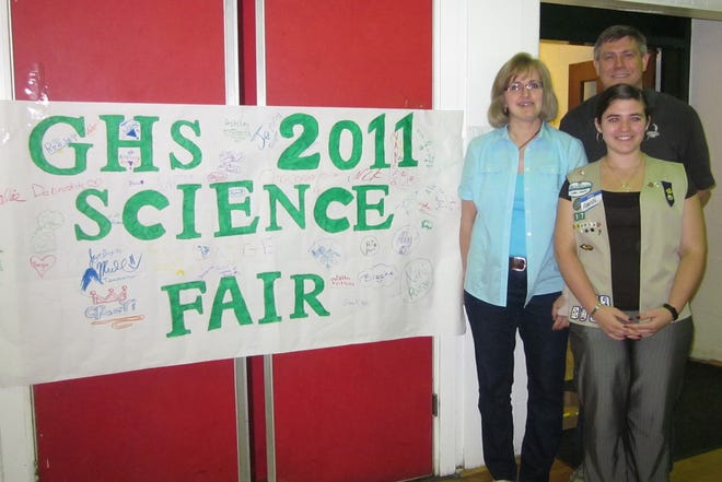 Submitted photo 
Science teachers Sue Stobie and Chris Hitzel stand with Girl Scout Amanda Norman at the Green Hills School Science Fair.