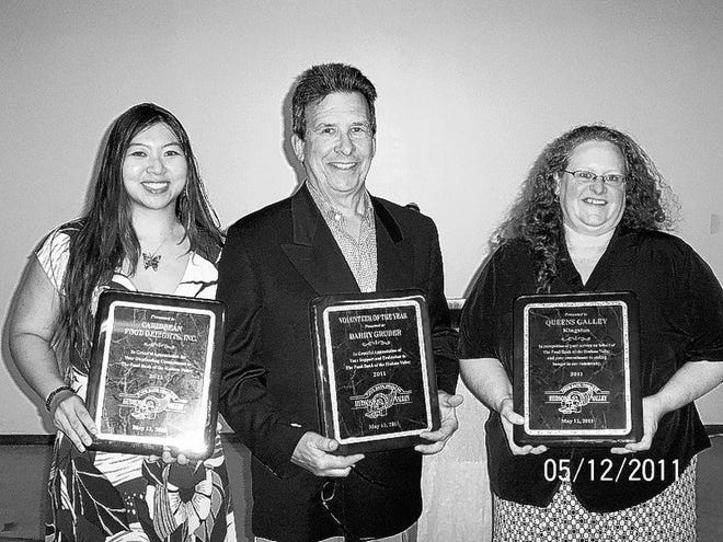 Accepting awards during the Food Bank of the Hudson Valley's annual reception are, from left, Sabrina HoSang of Caribbean Food Delights; Barry Gruber, volunteer; and Diane Reeder of Queen's Gallery.