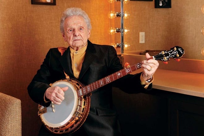 Ralph Stanley sits with his banjo backstage at the Grand Ole Opry House in Nashville, Tenn.