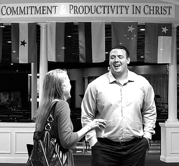 New York Jets defensive lineman Mike DeVito talks with a parishioner in Randolph, N.J., after he gave his first sermon at a church service. DeVito, a devout Christian, is considering a post-football career as a youth minister or pastor. He spoke for 20 minutes, complete with a PowerPoint presentation highlighting Biblical verses, about the meaning of faith. He also threw in a few jokes that drew a roomful of chuckles, and several of his points were met with an enthusiastic "Amen!" or "Yes! You're right!"