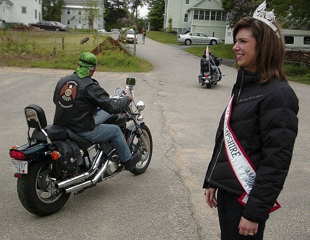 John Huff/Staff photographer 
Mrs. New Hampshire Kassie Dubois gives motorcyclists a warm send-off in Gonic Saturday before they ride to raise funds for Studio 109's Relay for Life team, Tutu for Tatas.