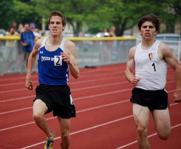 Pike/Citizen photo
Oyster River's Jack Collopy, left, outkicks Hanover's Joe Carey to win the 1,600-meter run Saturday in the Division II championship meet in Milford.