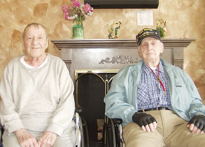 World War II Navy veterans Nick Lanza, left, and Bill Dygert shared their memories of the service on Thursday at Alpine Rehabilitation and Nursing Center in Little Falls. Lanza was a gunner’s mate aboard the USS Madison and Dygert was a baker aboard the USS Miami.