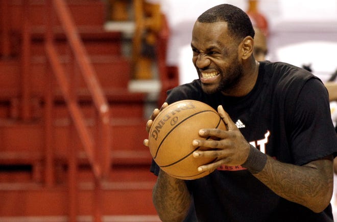 The Heat's LeBron James reacts to another player during practice on Monday in Miami.