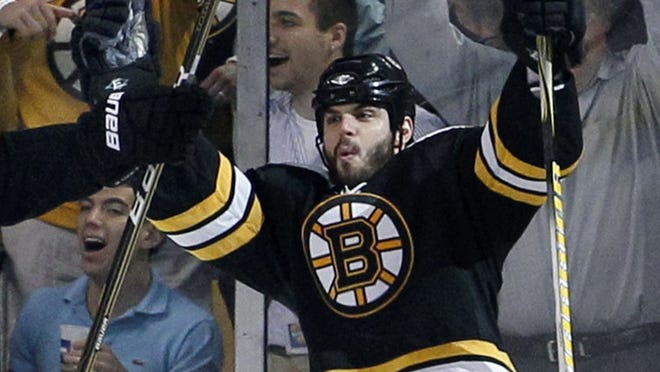 Boston Bruins' Nathan Horton celebrates his goal against the Tampa Bay Lightning in the third period of Game 7 of an NHL hockey Stanley Cup playoffs Eastern Conference final series in Boston, Friday, May 27, 2011. The Bruins won 1-0 advancing to the finals or the first time in more than two decades. (AP Photo/Elise Amendola)