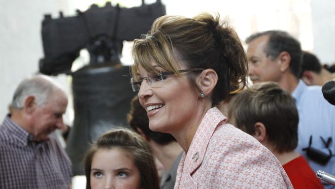 Sarah Palin, accompanied by daughter Piper, meets with people by the Liberty Bell at Independence National Historical Park on Tuesday in Philadelphia.