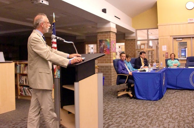 Director of Personnel Michael Ferrari, left, addresses the School Committee Wednesday.