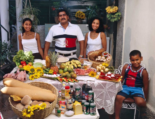 For the "Hungry Planet, What the World Eats" exhibit at the Underwood Center, artist Peter Menzel creates a digital jet print called "Family Portrait," depicting meal choices of the Costas in Havana, Cuba.
