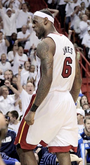 Miami Heat forward LeBron James reacts Tuesday during the second half of Game 1 of the NBA Finals against the Dallas Mavericks. The Associated Press