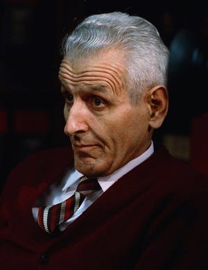 FILE - In this Dec. 3, 1990 file photo, Dr. Jack Kevorkian sits in his lawyer's office in Southfield, Mich., after Oakland County Prosecutor Richard Thompson announced that he would be charged with murder in the death of a woman who committed suicide by using a device of the doctor's. Kevorkian's lawyer and friend, Mayer Morganroth, says the assisted suicide advocate died Friday, June 3, 2011 at a Detroit-area hospital at the age of 83.