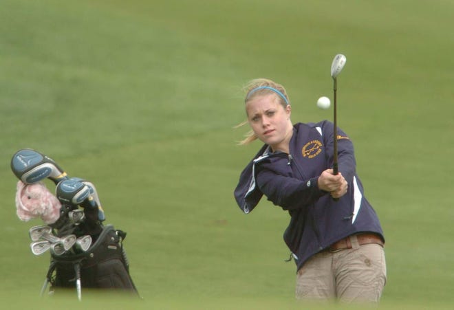 Woodstock Academy's Stacy Baranski chips her shot on the green at the 8th hole during the ECC girls golf championship at the Quinnatisset Country Club in Thompson.