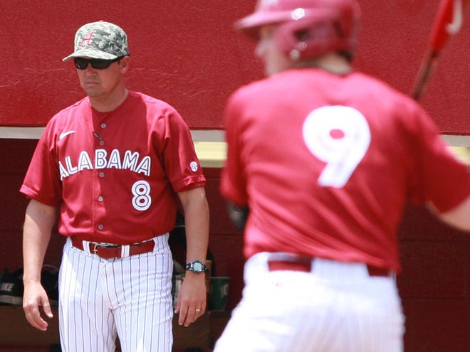 Alabama head coach Mitch Gaspard watches the field during the bottom of the first inning in the Crimson Tide's 9-0 win over LSU, May 8, 2011.