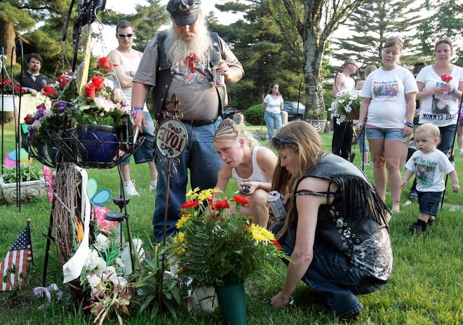 Friends and family gather during a memorial for Matthew Clarke at Greenwood Cemetery on Friday, June 3, 2011. Clarke died a year ago from a hit-and-run accident while riding his bike on Sandy Hollow Road. There are no suspects.