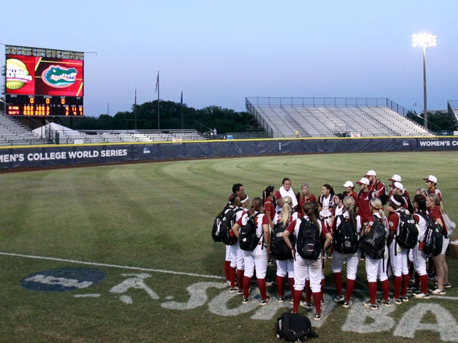 The University of Alabama softball team meets on the field after losing to Florida during the second game on Sunday.