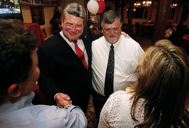 Photo by Daniel Freel/New Jersey Herald 
Republican state Sen. Steve Oroho, second from left, places his arm around candidate for freeholder Phil Crabb, second from right, as he shakes hands with Freeholder Director Rich Zeoli, left, and Assemblywoman Alison McHose, right, as they wait for the day's primary election results Tuesday at the Farmstead Country Club in Andover Township.