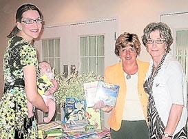 The Greater Florida Woman's Club's education chair Katie Aplin with daughter Maeve Aplin, ELC's Early Literacy coordinator Joan Whitson and club president Barbara Joyal, from left, stand with books collected to benefit the Early Learning Coalition of Putnam and St. Johns counties' Books for Bravery program. Contributed Photo