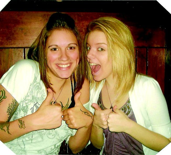 Cali Schroyer, left, goofs off with friend Courtney Stull in a recent photo.