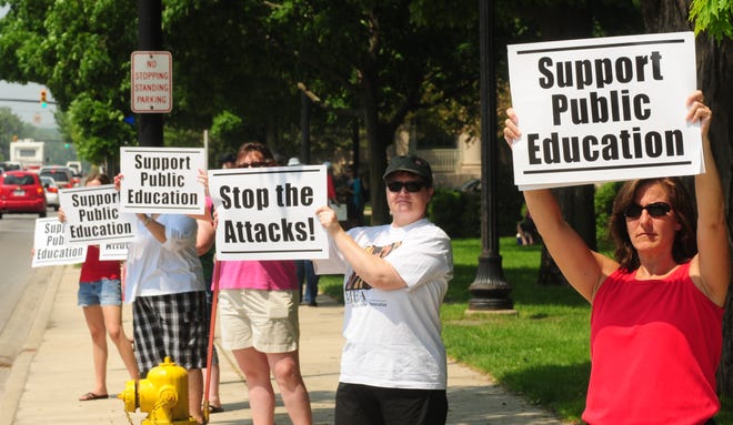 Area teachers protest recent cuts to education at Centennial Park Tuesday, June 7, 2011. Dennis R.J. Geppert/Sentinel Staff