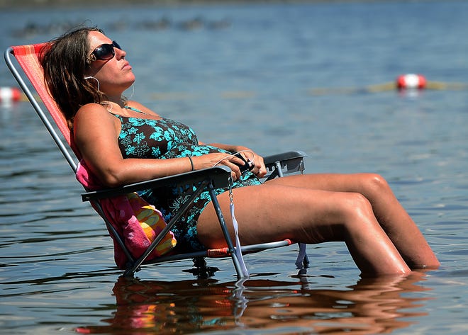 Wendy Wilson of Milford cools off at Hopkinton State Park Tuesday afternoon.