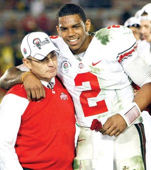 Ohio State coach Jim Tressel stands with quarterback Terrelle Pryor after winning the Rose Bowl on Jan. 1, 2010. File/AP Photo