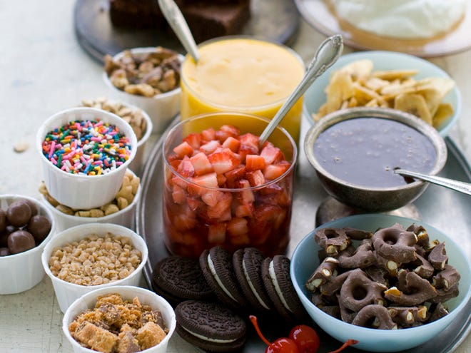Brownies, fruit, crushed and roasted nuts, whipped cream and a variety of sauces make for a great sundae bar.