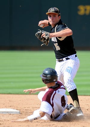 Bushland shortstop Brett Wilhelm attempts to turn a double play as Cameron's Michael Evan slides into second base Wednesday at Dell Diamond in Round Rock during a Class 2A state semifinal game.