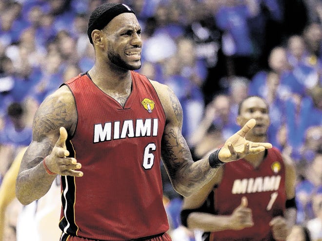 Miami Heat's LeBron James (6) reacts during the second half of Game 4 of the NBA Finals basketball game against the Dallas Mavericks Tuesday, June 7, 2011, in Dallas.