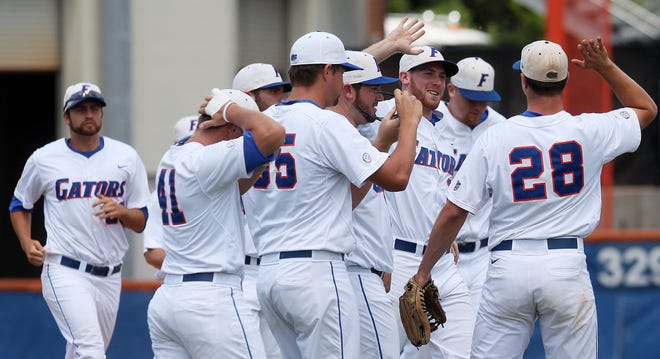 The University of Florida baseball team celebrates after their win over Mississippi State in the Super Regional opener on Friday at McKethan Stadium in Gainesville.