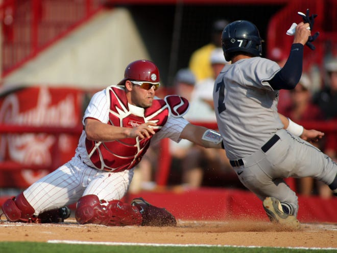 South Carolina catcher Robert Beary (4) tags Connecticut’s Nick Ahmed (7) in the second inning Saturday at Carolina Stadium in Columbia.